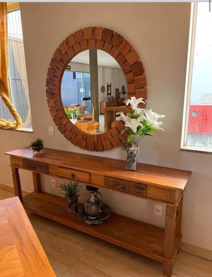 Solid wood console table with round wooden mirror